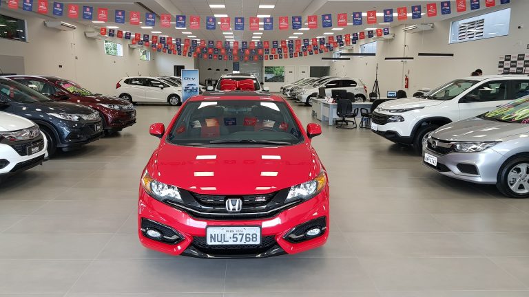 red car at a car dealership