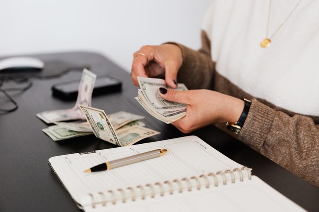 A person counting money.