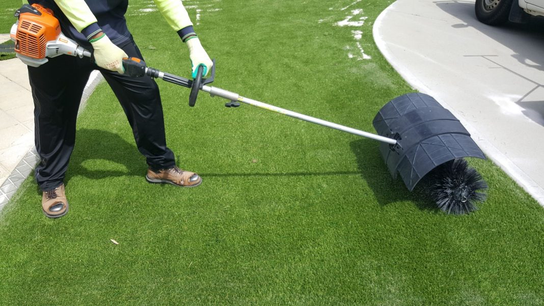 Cleaning artificial grass