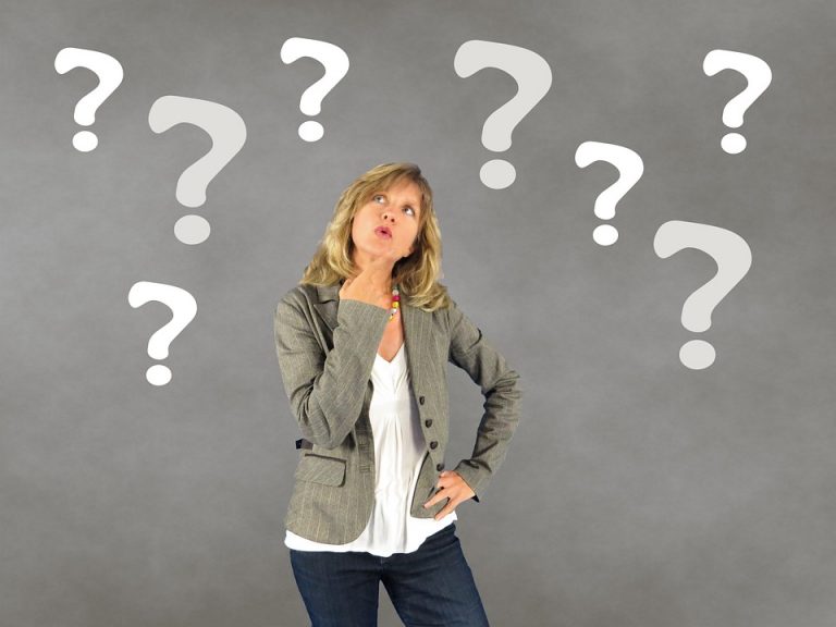 a woman surrounded with question marks because she is asking herself how to find the right commercial space in Plantation.